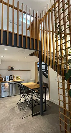 Staircase and kitchen at Panda Coworking