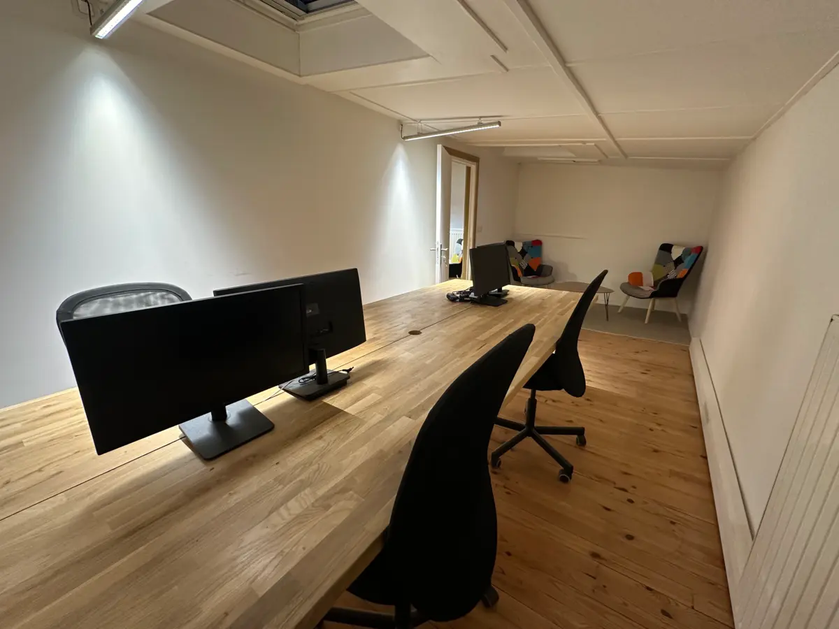 Private office with dual-screen desks at Panda Coworking