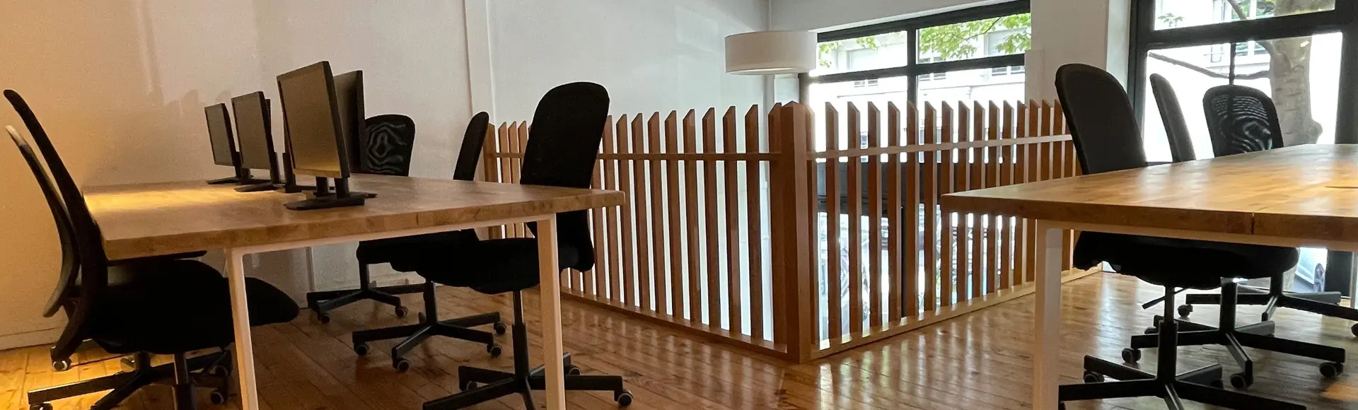 Desks with screens at Panda Coworking